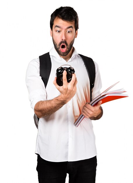 Student man holding vintage clock