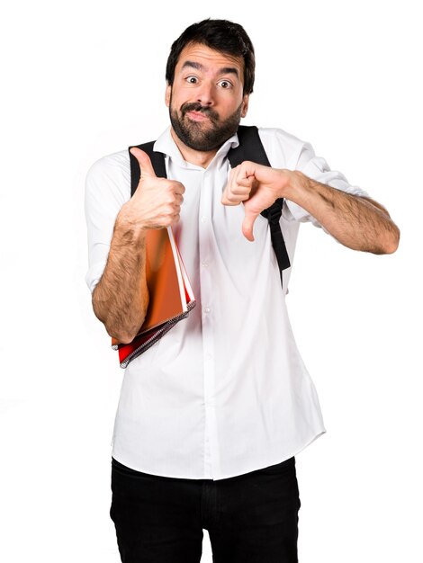 Student man making good-bad sign