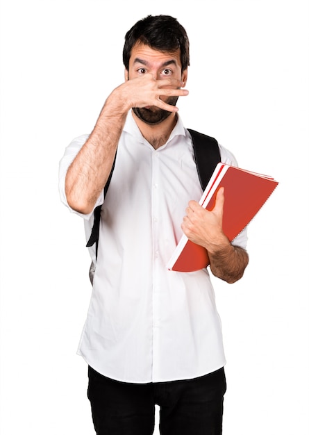 Free photo student man making smelling bad gesture