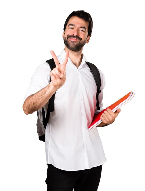 Student man making victory gesture