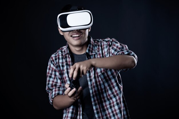 Student man wearing virtual reality goggles, VR headset. 