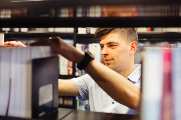 Student picking book in college