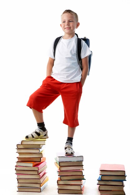 Student on a pile of books