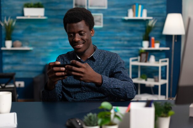 Student player holding smartphone in horizontal position