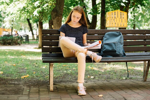 Student preparing for exams in park