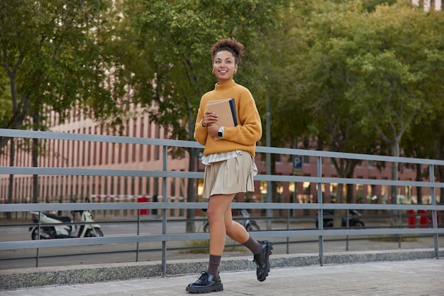 Student walks with organizer