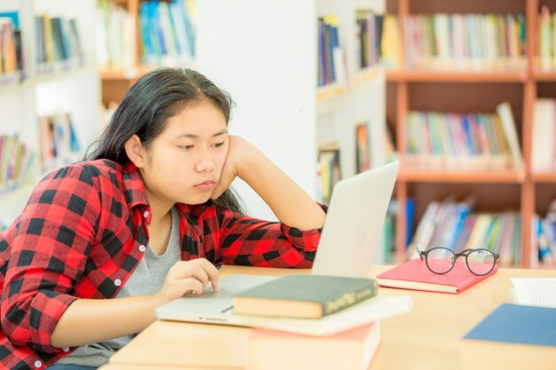  student working with her laptop