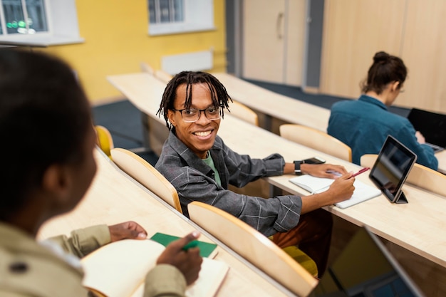 Free photo students attending a university class