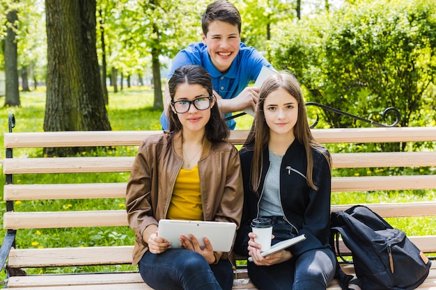 Students on a bench of the park