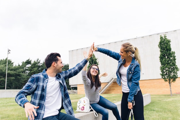 Free photo students giving high five