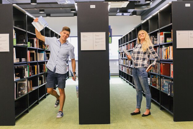 Students having fun in library