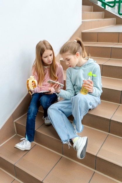 Students having lunch near canteen