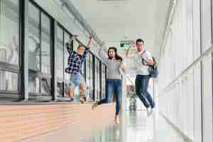 Free photo students jumping in college