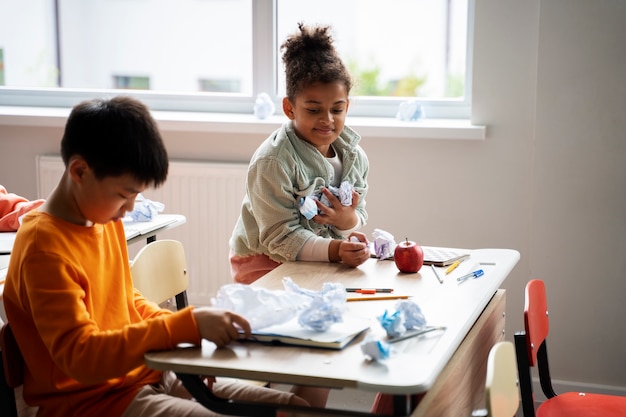 Free photo students learning at school in their classroom