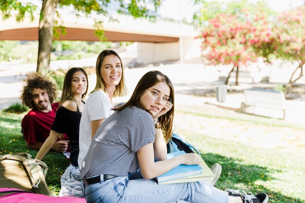 Students in park looking at camera