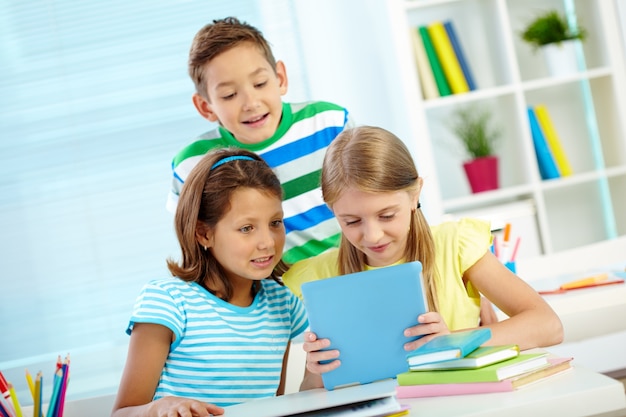 Students paying attention to the digital tablet