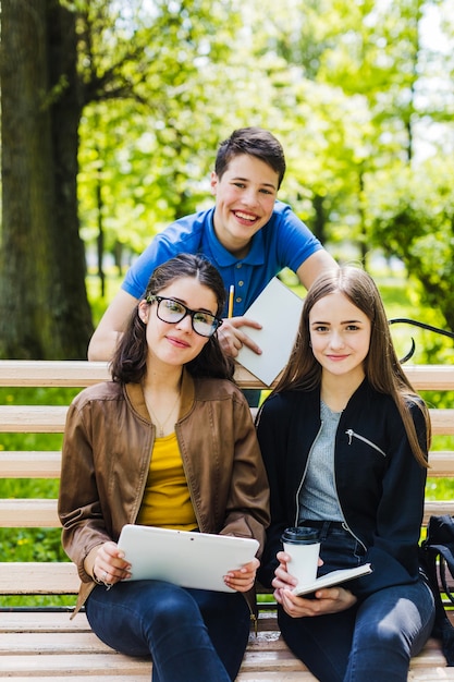 Students posing on the bench