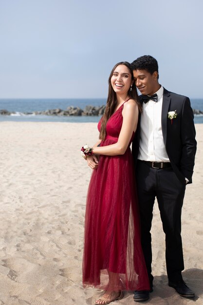 Students in prom clothing at the beach