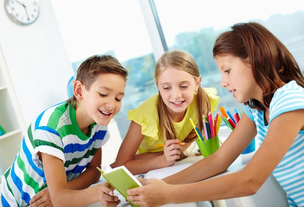 Students reading a book together