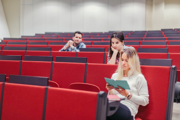 Free photo students sitting at lecture hall