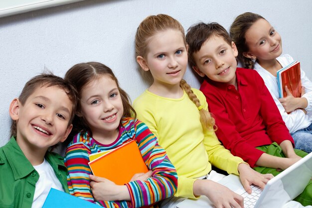 Students sitting in a row and laughing