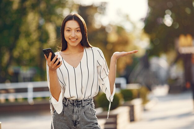 Students standing in a city with a mobile phone