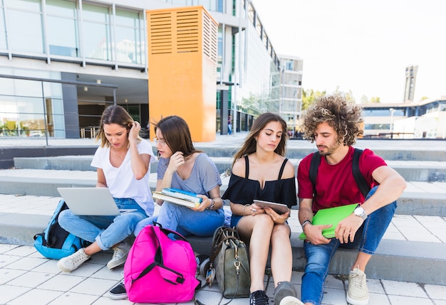 Students studying on street