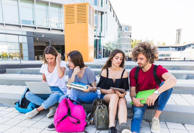 Students studying on street