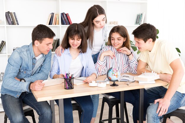 Students studying together in library