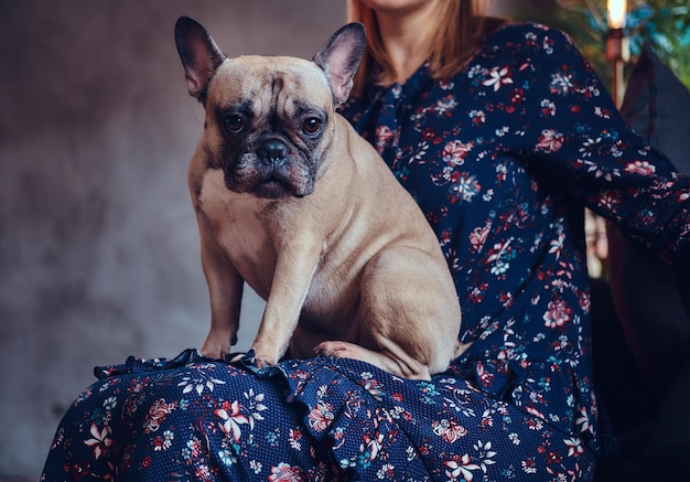 Studio portrait of an attractive happy blonde in a room with a loft interior.