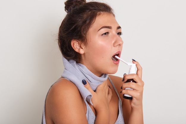 Studio portrait of attractive upset young brunette woman