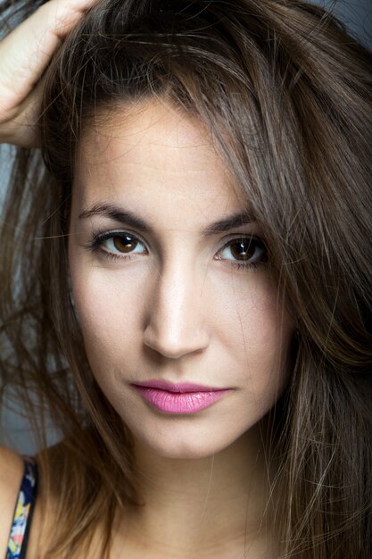 Studio Portrait of beautiful young woman posing