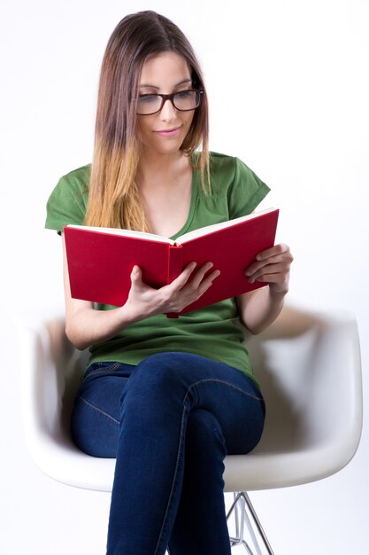 Studio portrait of  of Beautiful young woman reading