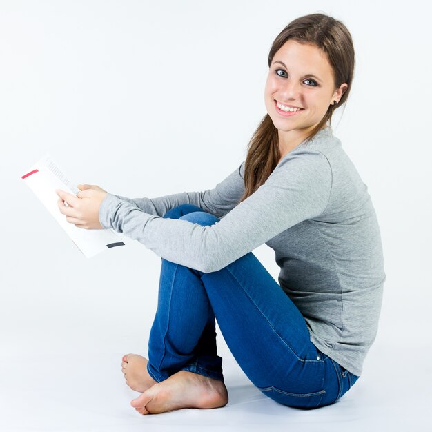 Studio portrait of  of Beautiful young woman reading