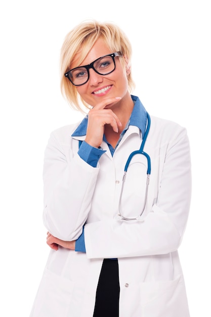 Studio portrait of confident young female doctor