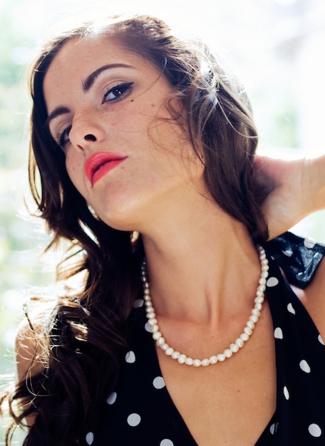 Studio Portrait of fashionable beautiful young woman posing