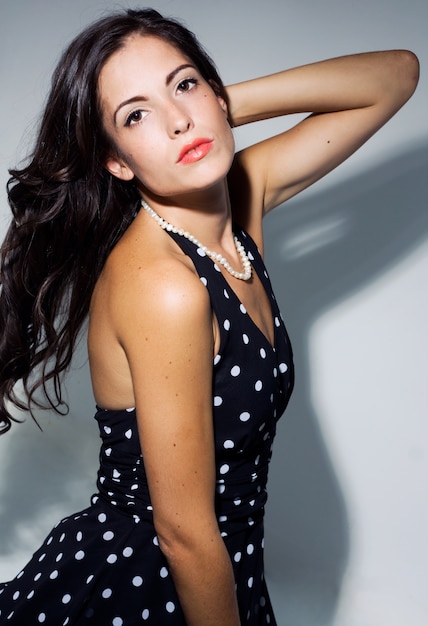 Studio Portrait of fashionable beautiful young woman posing