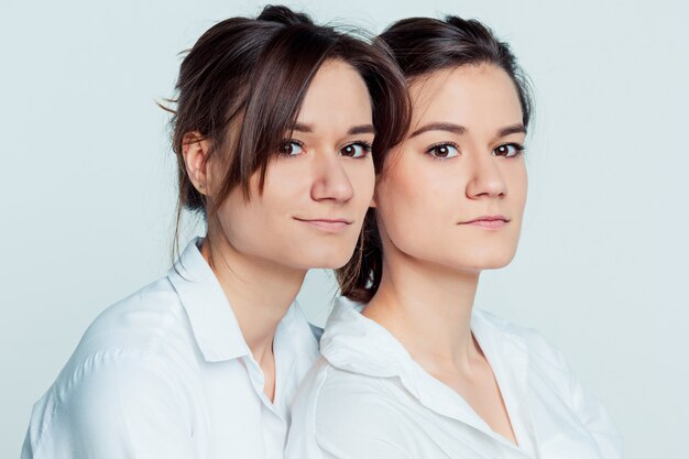 Studio portrait of female twins