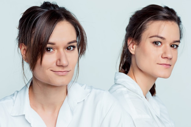 Studio portrait of female twins