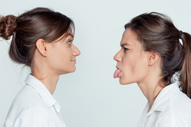 Studio portrait of female twins