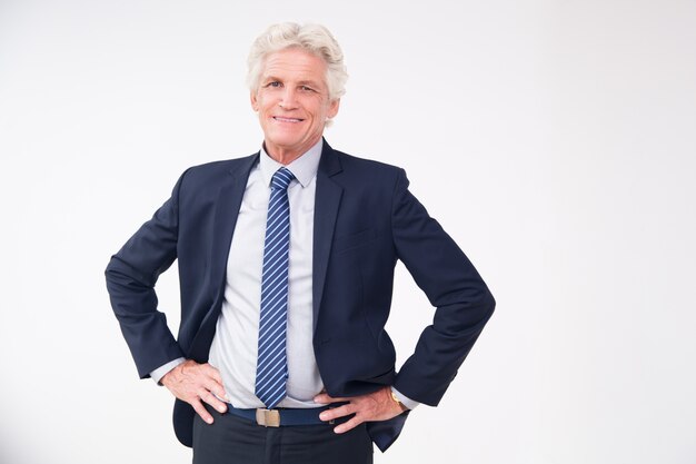 Studio portrait of successful senior businessman