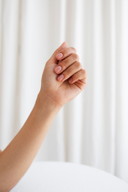 Free photo studio portrait with arm and white background