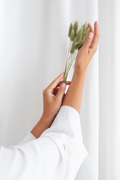 Free photo studio portrait with hands posing with plants