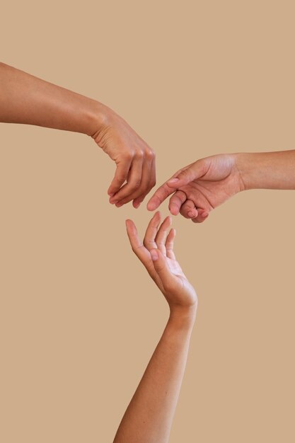 Studio portrait with people putting hands together