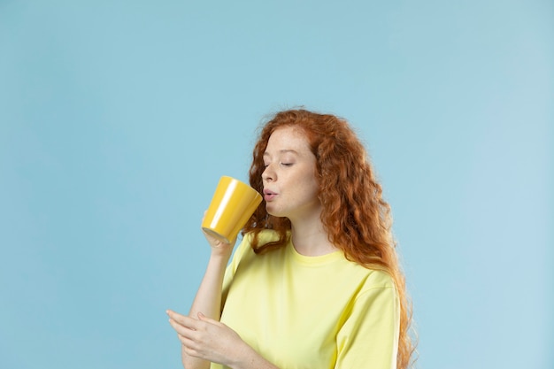 Studio portrait of woman with red hair