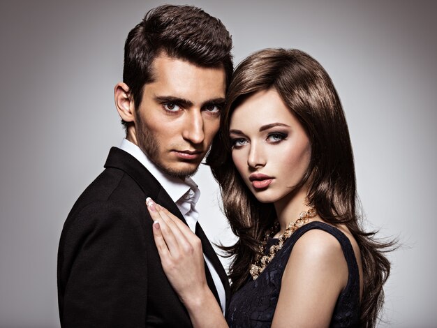 Studio portrait of young beautiful couple in love