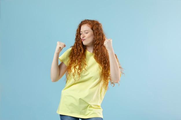 Studio portrait of young ginger woman