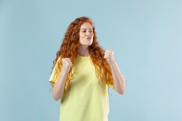 Studio portrait of young ginger woman