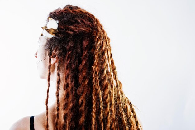 Studio shoot of back girl with dreads on white background