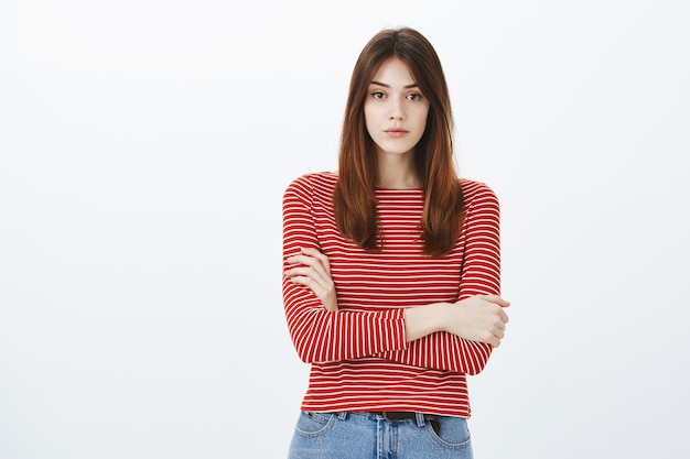 Studio shot of a brunette girl in casual outfit